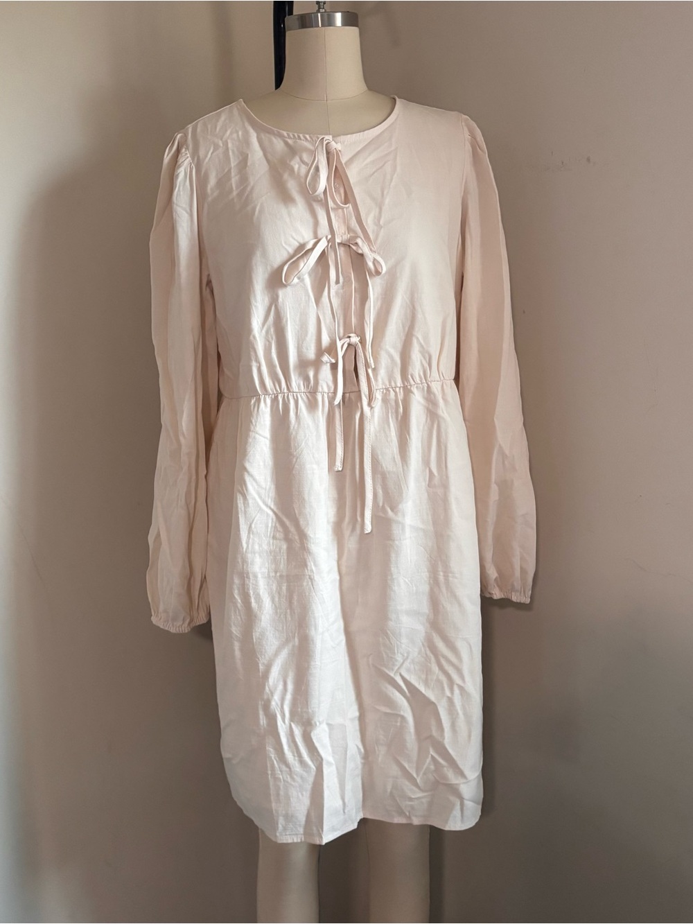 Zesica cream dress with tie front detail